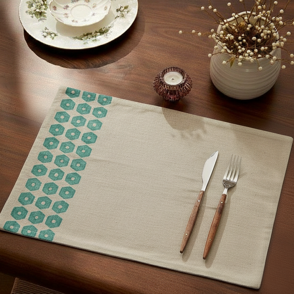 Beige chambray placemat with embroidered green hexagon border - geometric Babylonia design